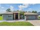 Charming single-story home featuring a brick facade, two-car garage, and well-maintained landscaping at 12910 Prestwick Dr, Riverview, FL 33579