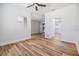 Bright open-concept living space with wood floors and easy access to the kitchen and backyard at 12910 Prestwick Dr, Riverview, FL 33579