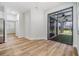 Open living area with access to a screened-in patio, featuring a fan and views of the backyard at 12910 Prestwick Dr, Riverview, FL 33579