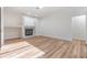 Spacious living room with light wood flooring and a modern fireplace, creating a cozy atmosphere at 12910 Prestwick Dr, Riverview, FL 33579