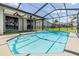 Inviting screened-in pool area offers refreshing enjoyment with beautiful backyard views and sunny skies at 12910 Prestwick Dr, Riverview, FL 33579