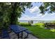 Lakefront backyard with a picnic table and dock at 1600 Lonesome Pine Ln, Tarpon Springs, FL 34689