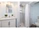 Updated bathroom with modern vanity, shower, and decorative tile at 1600 Lonesome Pine Ln, Tarpon Springs, FL 34689