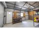 Well-lit interior of the workshop with utility table, shelving, and plenty of space at 1600 Lonesome Pine Ln, Tarpon Springs, FL 34689