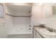 Bathroom features tiled shower and tub combination, granite countertop, and chrome hardware at 16113 Tampa St, Lutz, FL 33548