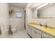 Clean bathroom with a single sink vanity and a shower with white tiled walls at 16113 Tampa St, Lutz, FL 33548