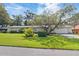 Attractive ranch-style home featuring an attached garage and large front yard at 16113 Tampa St, Lutz, FL 33548