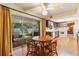 The kitchen features a breakfast nook with a table and a sliding door out to the screened in porch at 16113 Tampa St, Lutz, FL 33548