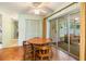 The kitchen nook has a table with four chairs and sliding doors leading to the screened patio at 16113 Tampa St, Lutz, FL 33548