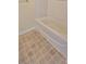 Close up of a bath tub with linoleum flooring in the bathroom at 16501 Harper Pond Ln # 308, Odessa, FL 33556