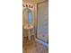 Cozy bathroom featuring a glass-enclosed shower and pedestal sink at 16501 Harper Pond Ln # 308, Odessa, FL 33556