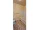 Well-lit bathroom featuring tiled floors, a soaking tub, and a toilet at 16501 Harper Pond Ln # 308, Odessa, FL 33556