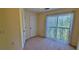 A large bedroom with sliding glass doors and neutral carpet at 16501 Harper Pond Ln # 308, Odessa, FL 33556