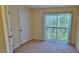 Bedroom featuring a closet, sliding glass doors and neutral carpet at 16501 Harper Pond Ln # 308, Odessa, FL 33556