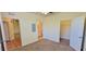 Spacious bedroom with doorways to the hallway, closet, and bathroom at 16501 Harper Pond Ln # 308, Odessa, FL 33556