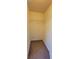 A small closet with neutral carpet and a wire shelf for storage at 16501 Harper Pond Ln # 308, Odessa, FL 33556