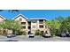 Attractive condominium building with assigned parking and mature landscaping at 16501 Harper Pond Ln # 308, Odessa, FL 33556
