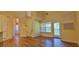 Large living room with spiral stairs leading up to the loft and balcony access at 16501 Harper Pond Ln # 308, Odessa, FL 33556