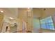 Upstairs loft featuring an overlooking view of the kitchen and downstairs living area at 16501 Harper Pond Ln # 308, Odessa, FL 33556