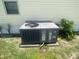 Exterior view of the home's air conditioning unit on a sunny day, positioned near vibrant greenery at 1710 7Th Sw St # 39, Ruskin, FL 33570