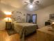 Comfortable bedroom with natural light, ceiling fan, and charming decor at 1710 7Th Sw St # 39, Ruskin, FL 33570