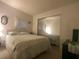 Serene bedroom featuring a comfortable bed and mirrored closet at 1710 7Th Sw St # 39, Ruskin, FL 33570