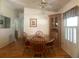 Cozy dining room with wooden table, chairs, and natural light from the window at 1710 7Th Sw St # 39, Ruskin, FL 33570