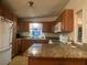 Well-equipped kitchen with granite countertops and ample cabinet space at 1710 7Th Sw St # 39, Ruskin, FL 33570