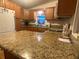 Well-equipped kitchen with granite countertops and ample cabinet space at 1710 7Th Sw St # 39, Ruskin, FL 33570