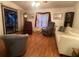 Inviting living room featuring hardwood floors and comfortable seating arrangement with sliders to lanai at 1710 7Th Sw St # 39, Ruskin, FL 33570