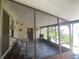 Enclosed patio with tile flooring and screens, offering a shaded outdoor space for relaxation and entertainment at 1710 7Th Sw St # 39, Ruskin, FL 33570