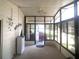 Enclosed porch featuring ample natural light and a view of the home's driveway at 1710 7Th Sw St # 39, Ruskin, FL 33570