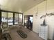Cozy enclosed porch furnished with comfortable seating and a chest of drawers at 1710 7Th Sw St # 39, Ruskin, FL 33570