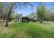 View of backyard with patio and screened area at 17207 Bosley Dr, Spring Hill, FL 34610