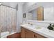 Bathroom featuring a shower, toilet, sink and vanity, providing a functional space at 17207 Bosley Dr, Spring Hill, FL 34610