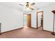 This bedroom has carpet, a ceiling fan, and a closet at 17207 Bosley Dr, Spring Hill, FL 34610