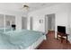 Spacious bedroom boasts mirrored closet doors, ensuite bathroom and an adjacent door at 17207 Bosley Dr, Spring Hill, FL 34610