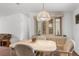 Well lit dining room with a dining table with chairs and built-in buffet at 17207 Bosley Dr, Spring Hill, FL 34610