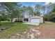 Exterior showcasing a single-story home with attached garage and green lawn at 17207 Bosley Dr, Spring Hill, FL 34610