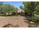 Charming single-story home with mature trees, a stone chimney, and a well-maintained front yard at 17207 Bosley Dr, Spring Hill, FL 34610