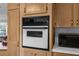 Modern built-in oven with a microwave shelf in a bright kitchen at 17207 Bosley Dr, Spring Hill, FL 34610