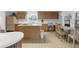 Sunny kitchen with a breakfast nook and ample counter space overlooking the backyard at 17207 Bosley Dr, Spring Hill, FL 34610