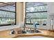 Kitchen stainless sink and faucet under a bright window with a backyard view at 17207 Bosley Dr, Spring Hill, FL 34610