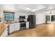 Kitchen with stainless appliances, white cabinetry and a long countertop at 17207 Bosley Dr, Spring Hill, FL 34610