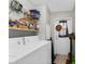 Functional laundry room featuring a washer, dryer, shelves and a door to the outside at 17207 Bosley Dr, Spring Hill, FL 34610