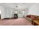 Bright living room featuring a window, ceiling fan and carpeted floors at 17207 Bosley Dr, Spring Hill, FL 34610