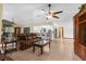 Open concept living area with tile floors and a view of the kitchen and breakfast bar at 17207 Bosley Dr, Spring Hill, FL 34610