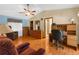 Spacious main bedroom with an ensuite bathroom, wood floors, and a ceiling fan at 17207 Bosley Dr, Spring Hill, FL 34610