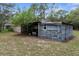 Exterior image of backyard shed with damage at 17207 Bosley Dr, Spring Hill, FL 34610