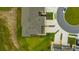 An aerial of a roof, lawn, and driveway at 17741 Tawny Malt Pl, Land O Lakes, FL 34638